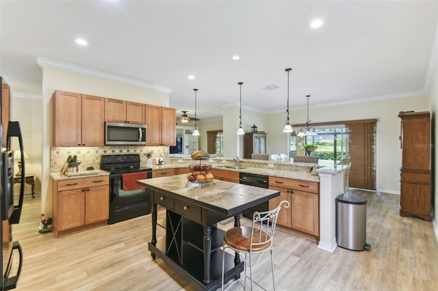 217 Sorrento Rd, Poinciana, FL 34759 - kitchen featuring black appliances, a peninsula, tasteful backsplash, light wood-type flooring, and hanging light fixtures