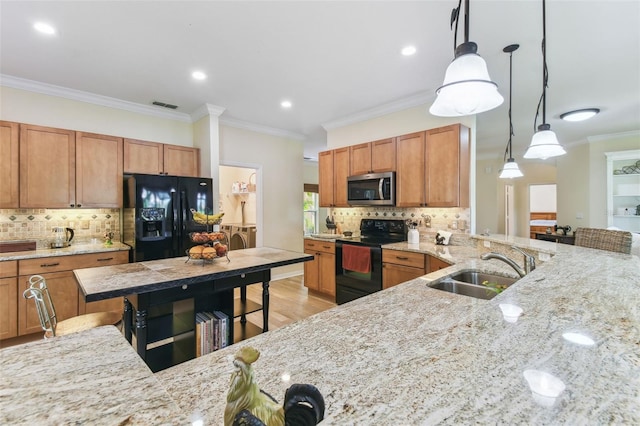 217 Sorrento Rd, Poinciana, FL 34759 - kitchen with black appliances, decorative backsplash, pendant lighting, ornamental molding, and brown cabinets