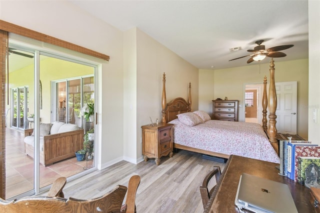 217 Sorrento Rd, Poinciana, FL 34759 - bedroom with light wood-style flooring, multiple windows, and ensuite bathroom