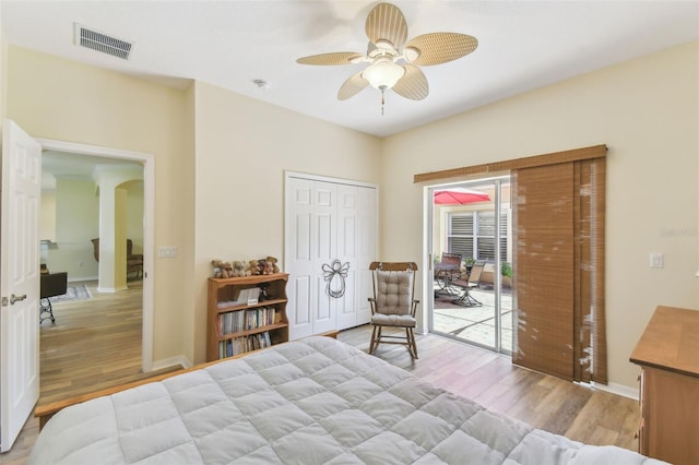 217 Sorrento Rd, Poinciana, FL 34759 - bedroom featuring wood finished floors, access to outside, arched walkways, and a ceiling fan