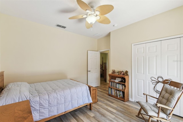 217 Sorrento Rd, Poinciana, FL 34759 - bedroom featuring light wood-style flooring, a closet, and a ceiling fan