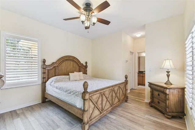 217 Sorrento Rd, Poinciana, FL 34759 - bedroom featuring light wood-style floors, multiple windows, and ceiling fan