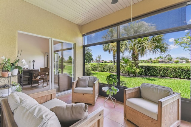217 Sorrento Rd, Poinciana, FL 34759 - sunroom featuring an outdoor hangout area, a textured wall, and tile patterned flooring
