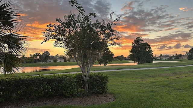 217 Sorrento Rd, Poinciana, FL 34759 - surrounding community featuring a water view and a lawn