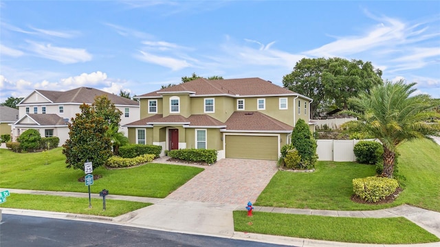 12353 Hammock Hill Dr, Clermont, FL 34711 - view of front of property with stucco siding, driveway, and an attached garage