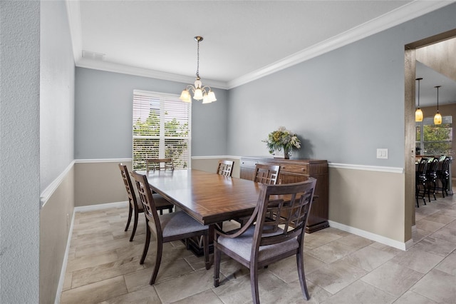 12353 Hammock Hill Dr, Clermont, FL 34711 - dining space featuring a chandelier, crown molding, and light tile patterned floors