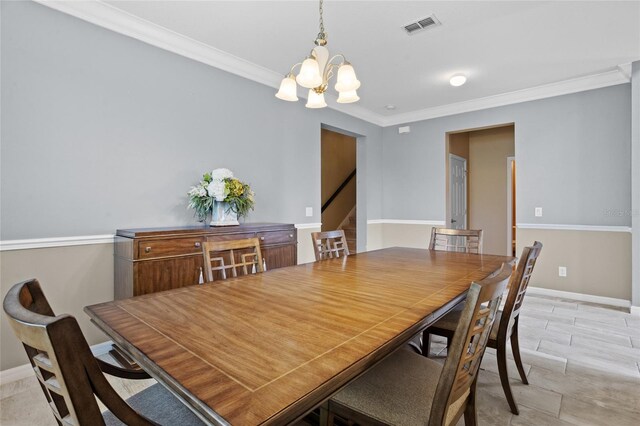 12353 Hammock Hill Dr, Clermont, FL 34711 - dining area with a chandelier, ornamental molding, and stairs
