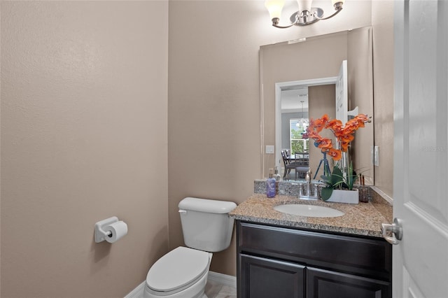 12353 Hammock Hill Dr, Clermont, FL 34711 - bathroom featuring vanity and a chandelier