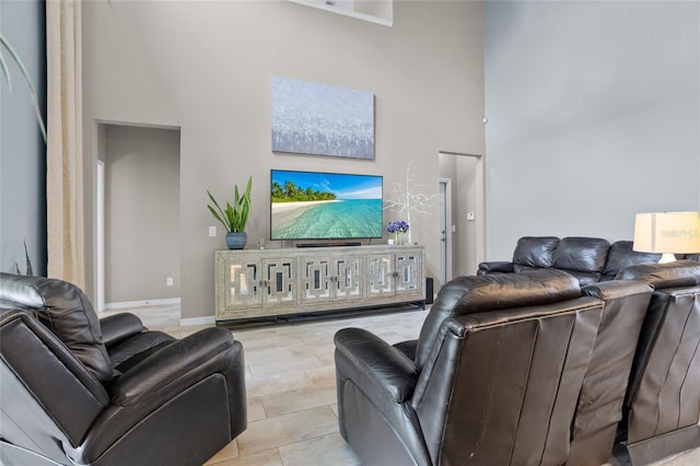 12353 Hammock Hill Dr, Clermont, FL 34711 - living area featuring a high ceiling and baseboards