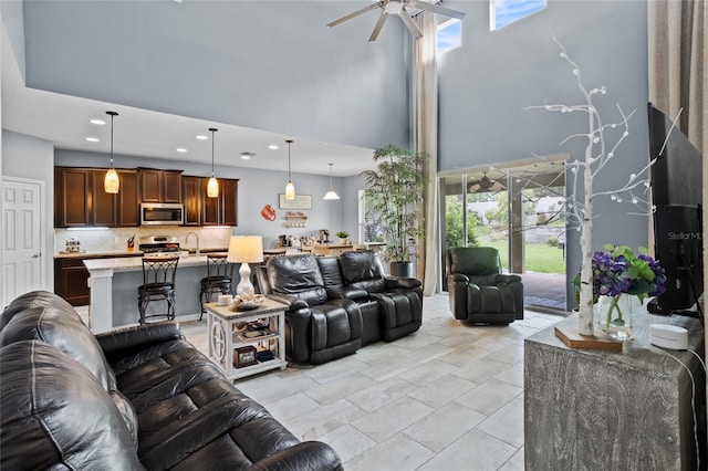 12353 Hammock Hill Dr, Clermont, FL 34711 - living area featuring a towering ceiling, a ceiling fan, and recessed lighting