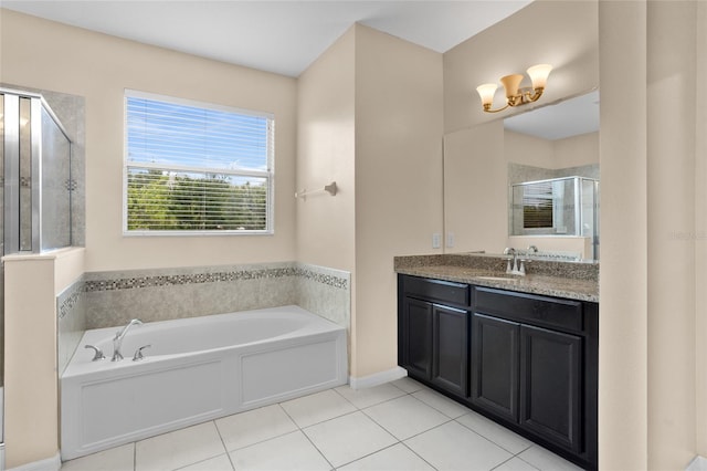 12353 Hammock Hill Dr, Clermont, FL 34711 - full bathroom featuring vanity, a garden tub, tile patterned flooring, and a stall shower