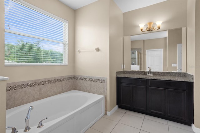 12353 Hammock Hill Dr, Clermont, FL 34711 - full bathroom featuring vanity, a bath, healthy amount of natural light, and tile patterned floors