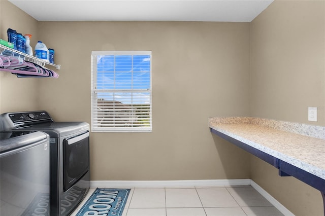 12353 Hammock Hill Dr, Clermont, FL 34711 - laundry room featuring washer and dryer and light tile patterned flooring