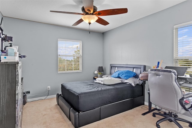 12353 Hammock Hill Dr, Clermont, FL 34711 - carpeted bedroom featuring multiple windows and ceiling fan