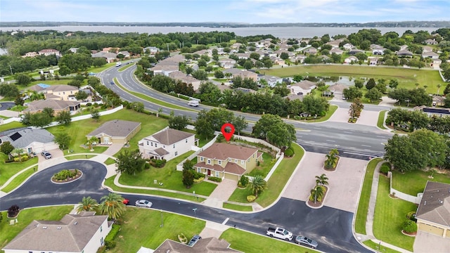 12353 Hammock Hill Dr, Clermont, FL 34711 - aerial view of property's location featuring nearby suburban area and a nearby body of water