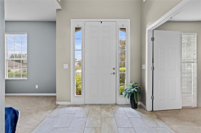 12353 Hammock Hill Dr, Clermont, FL 34711 - entryway featuring light carpet and baseboards