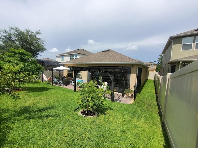 1456 Sourwood Dr, Ocoee, FL 34761 - rear view of property featuring a patio area, a fenced backyard, a gazebo, and stucco siding