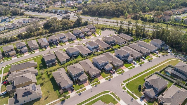 1456 Sourwood Dr, Ocoee, FL 34761 - aerial view of property and surrounding area with nearby suburban area and a large body of water