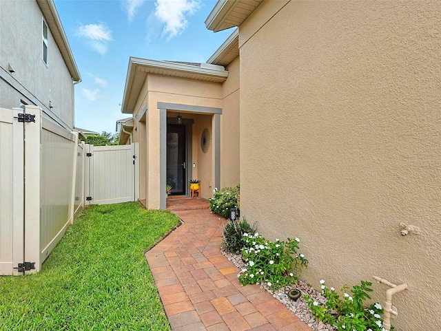 1456 Sourwood Dr, Ocoee, FL 34761 - property entrance featuring a gate and stucco siding