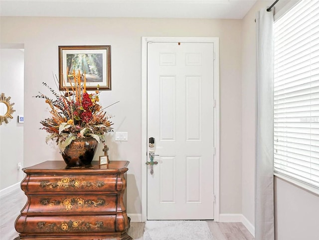 1456 Sourwood Dr, Ocoee, FL 34761 - entrance foyer featuring baseboards and light wood-style floors