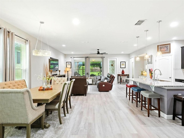 1456 Sourwood Dr, Ocoee, FL 34761 - dining area featuring light wood-type flooring, ceiling fan, and recessed lighting
