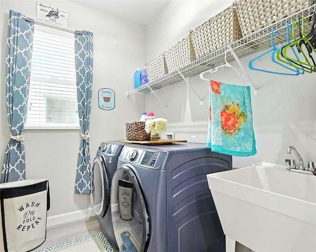 1456 Sourwood Dr, Ocoee, FL 34761 - laundry room with washer and dryer and wood finished floors