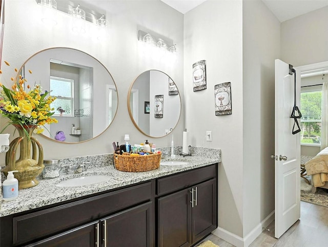 1456 Sourwood Dr, Ocoee, FL 34761 - bathroom featuring double vanity and ensuite bathroom