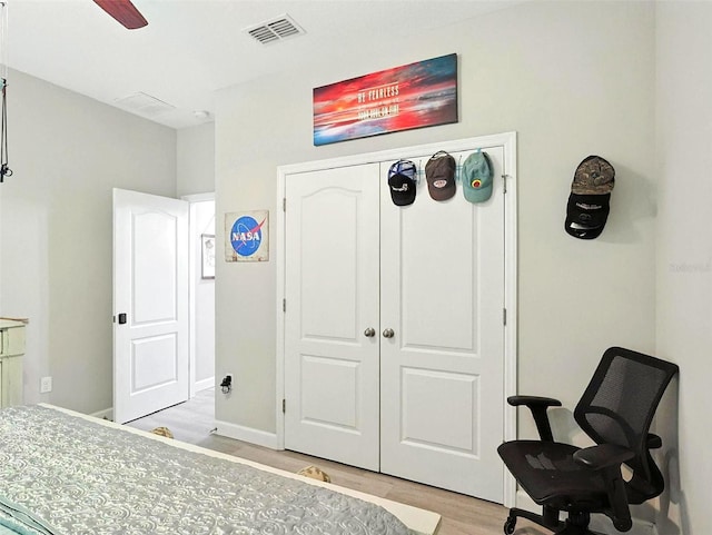 1456 Sourwood Dr, Ocoee, FL 34761 - bedroom featuring light wood-style flooring, a closet, and a ceiling fan