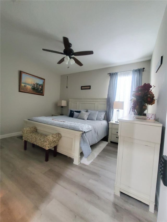 1456 Sourwood Dr, Ocoee, FL 34761 - bedroom featuring light wood finished floors and ceiling fan
