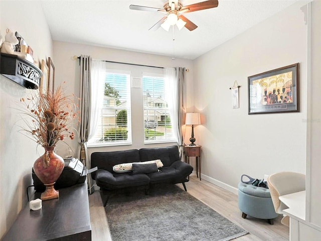 1456 Sourwood Dr, Ocoee, FL 34761 - living area featuring light wood-type flooring and ceiling fan