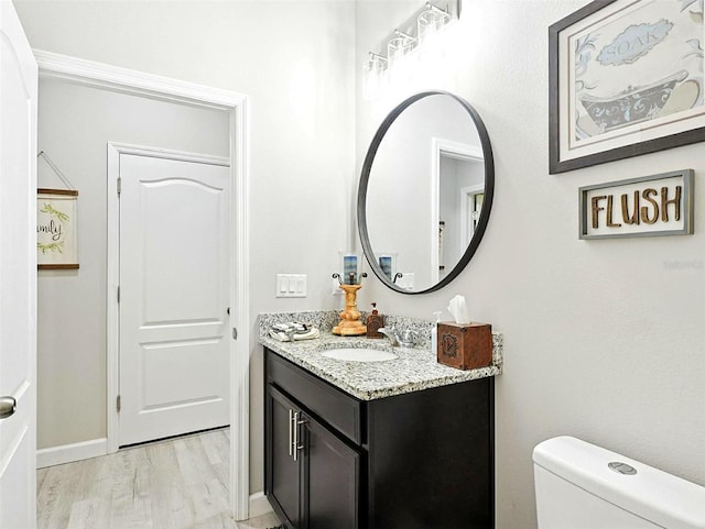 1456 Sourwood Dr, Ocoee, FL 34761 - half bathroom featuring vanity and wood finished floors