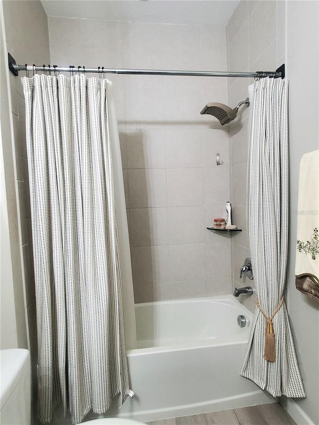 1456 Sourwood Dr, Ocoee, FL 34761 - bathroom featuring shower / tub combo and toilet