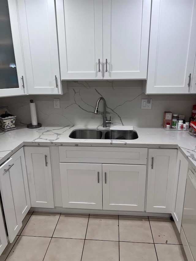 6831 SW 147th Ave Unit 3H, Miami, FL 33193 - kitchen featuring white cabinetry, light tile patterned flooring, tasteful backsplash, and light stone countertops