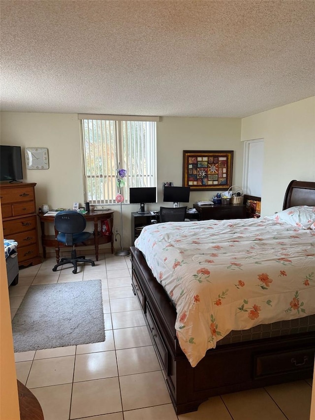 6831 SW 147th Ave Unit 3H, Miami, FL 33193 - bedroom featuring a textured ceiling and light tile patterned flooring