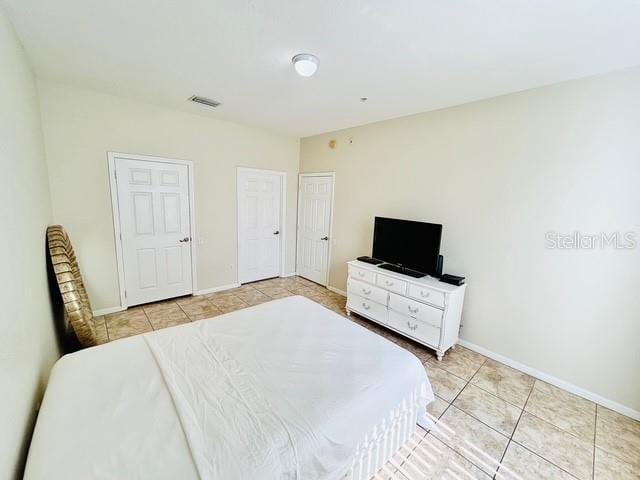 13500 Turtle Marsh Loop Unit 17, Orlando, FL 32837 - bedroom featuring light tile patterned floors