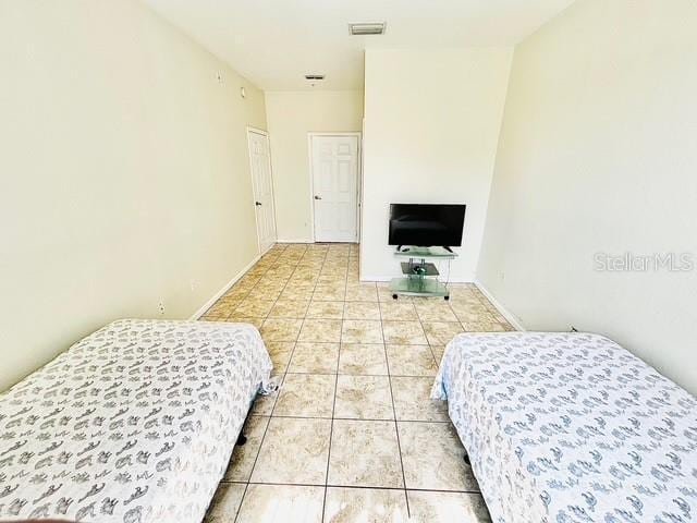 13500 Turtle Marsh Loop Unit 17, Orlando, FL 32837 - tiled bedroom with baseboards