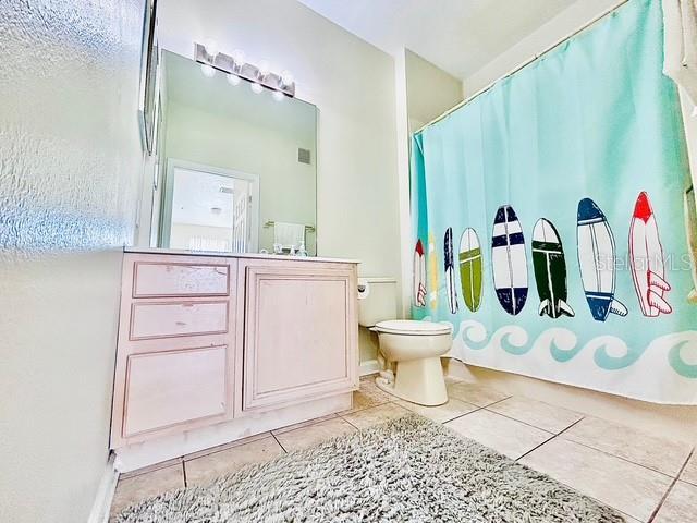13500 Turtle Marsh Loop Unit 17, Orlando, FL 32837 - full bath featuring tile patterned floors and vanity