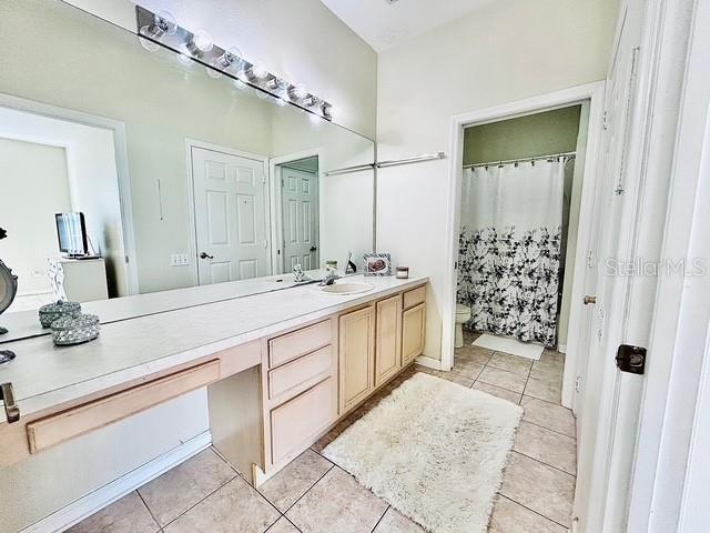 13500 Turtle Marsh Loop Unit 17, Orlando, FL 32837 - bathroom with vanity and tile patterned floors