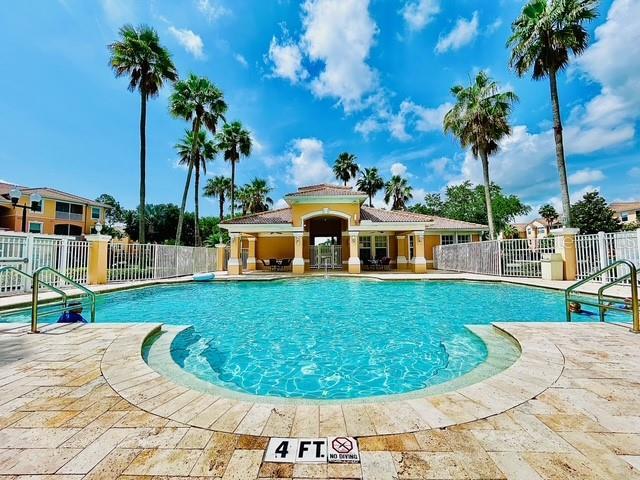 13500 Turtle Marsh Loop Unit 17, Orlando, FL 32837 - community pool featuring a patio area