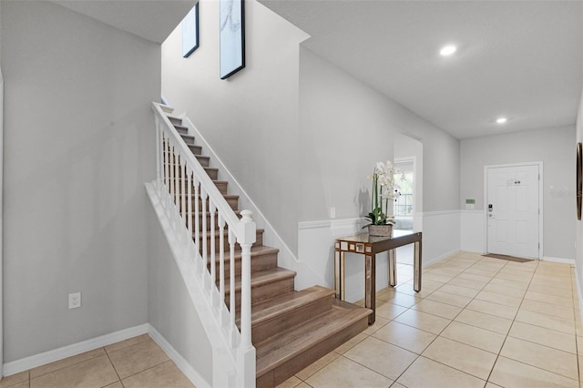 2131 Lelani Cir, Davenport, FL 33897 - foyer with stairway, light tile patterned floors, and recessed lighting