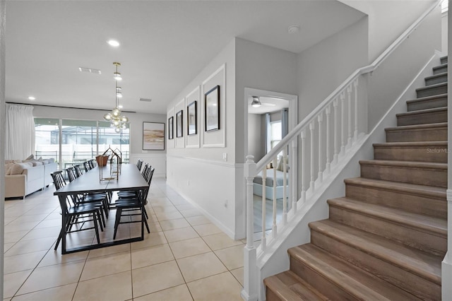 2131 Lelani Cir, Davenport, FL 33897 - dining area featuring stairs, light tile patterned flooring, and recessed lighting