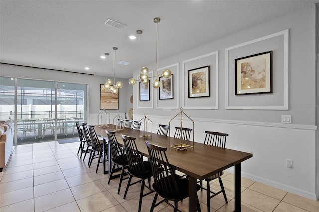 2131 Lelani Cir, Davenport, FL 33897 - dining area featuring light tile patterned floors and recessed lighting