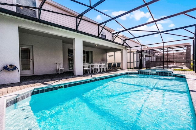 2131 Lelani Cir, Davenport, FL 33897 - view of pool with a patio, a pool with connected hot tub, and glass enclosure