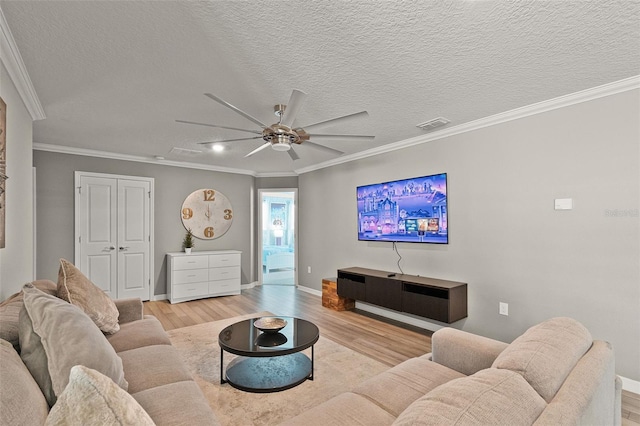 2131 Lelani Cir, Davenport, FL 33897 - living room with light wood-type flooring, a ceiling fan, ornamental molding, and a textured ceiling