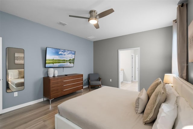 2131 Lelani Cir, Davenport, FL 33897 - bedroom featuring light wood finished floors and a ceiling fan