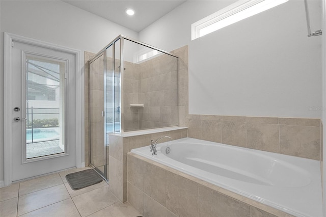 2131 Lelani Cir, Davenport, FL 33897 - bathroom with a garden tub, a stall shower, and tile patterned floors