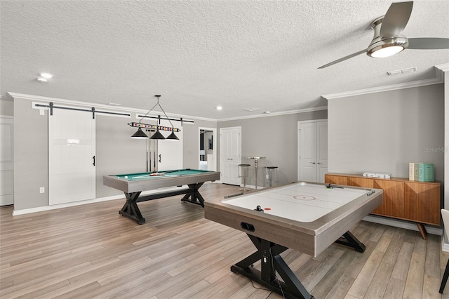 2131 Lelani Cir, Davenport, FL 33897 - playroom with a barn door, light wood-style floors, billiards, ceiling fan, and a textured ceiling