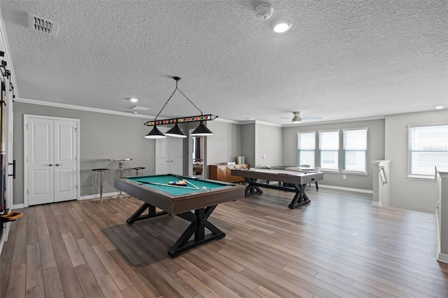 2131 Lelani Cir, Davenport, FL 33897 - game room with billiards, wood finished floors, a textured ceiling, crown molding, and ceiling fan