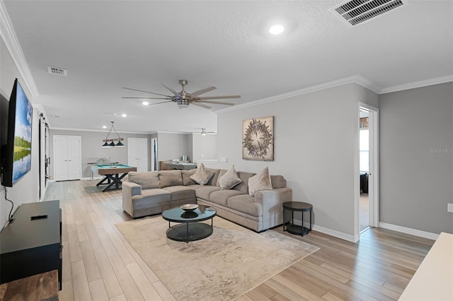 2131 Lelani Cir, Davenport, FL 33897 - living room with pool table, light wood finished floors, ornamental molding, recessed lighting, and a ceiling fan