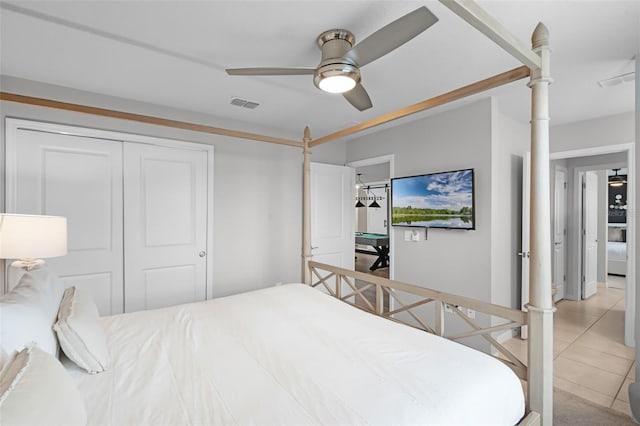 2131 Lelani Cir, Davenport, FL 33897 - bedroom featuring light tile patterned flooring, a closet, and a ceiling fan